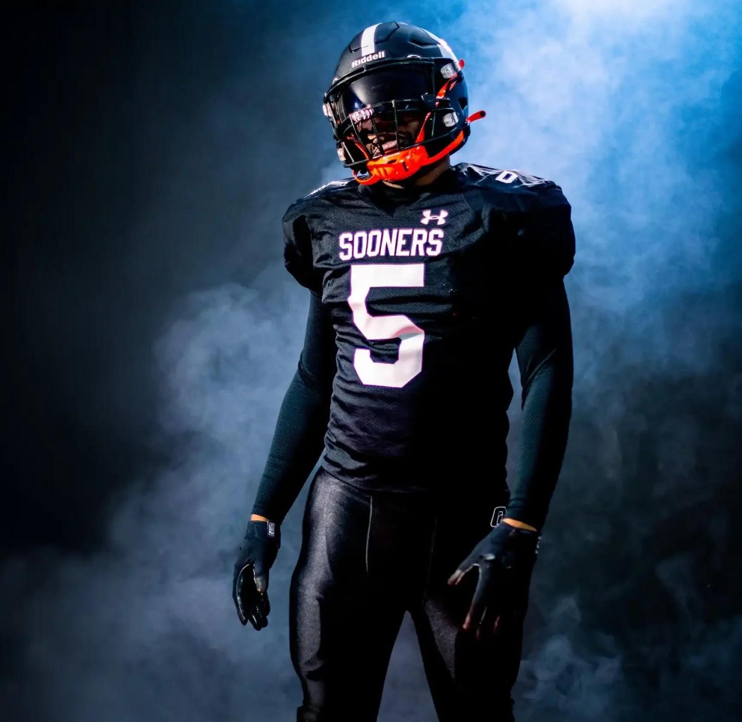 Ottawa Sooners player #5 in action with dramatic lighting and smoke effects